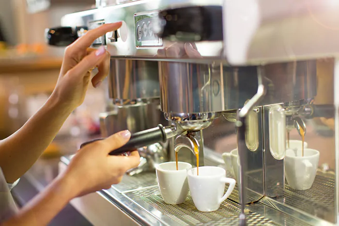 A coffee machine dispensing Espresso.