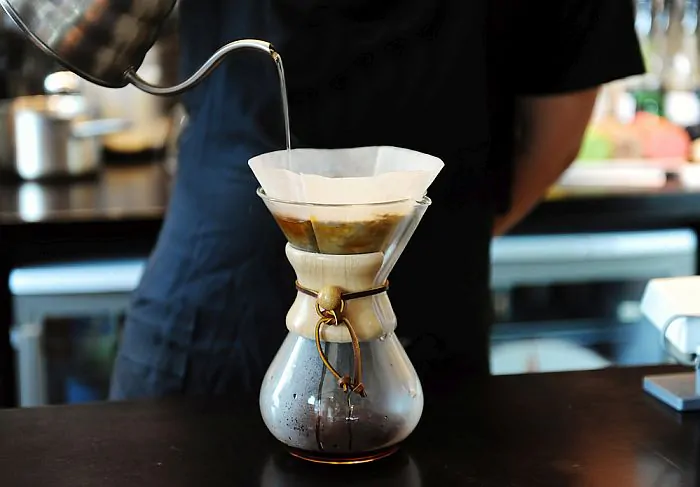 Brewing a regular cup of coffee using the pour-over method.